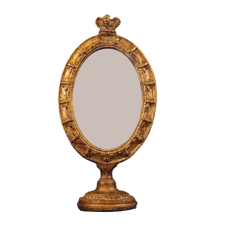 Förgylld rund fotoram med fot och krona på toppen