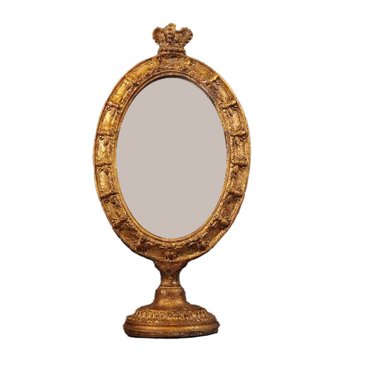 Förgylld rund fotoram med fot och krona på toppen