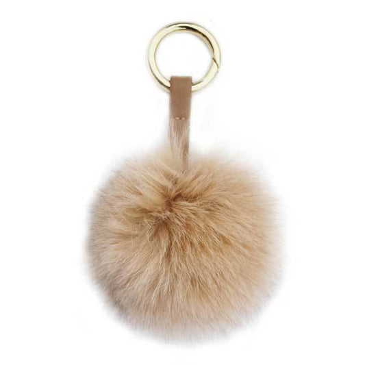 Beige fluffig päls boll