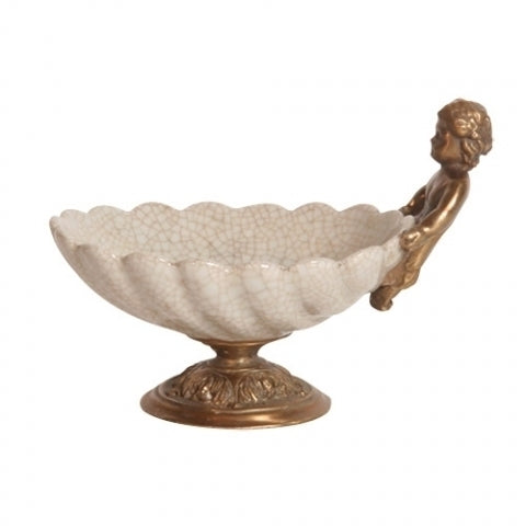 Skål i form av snäcka med mässingsfärgade detaljer