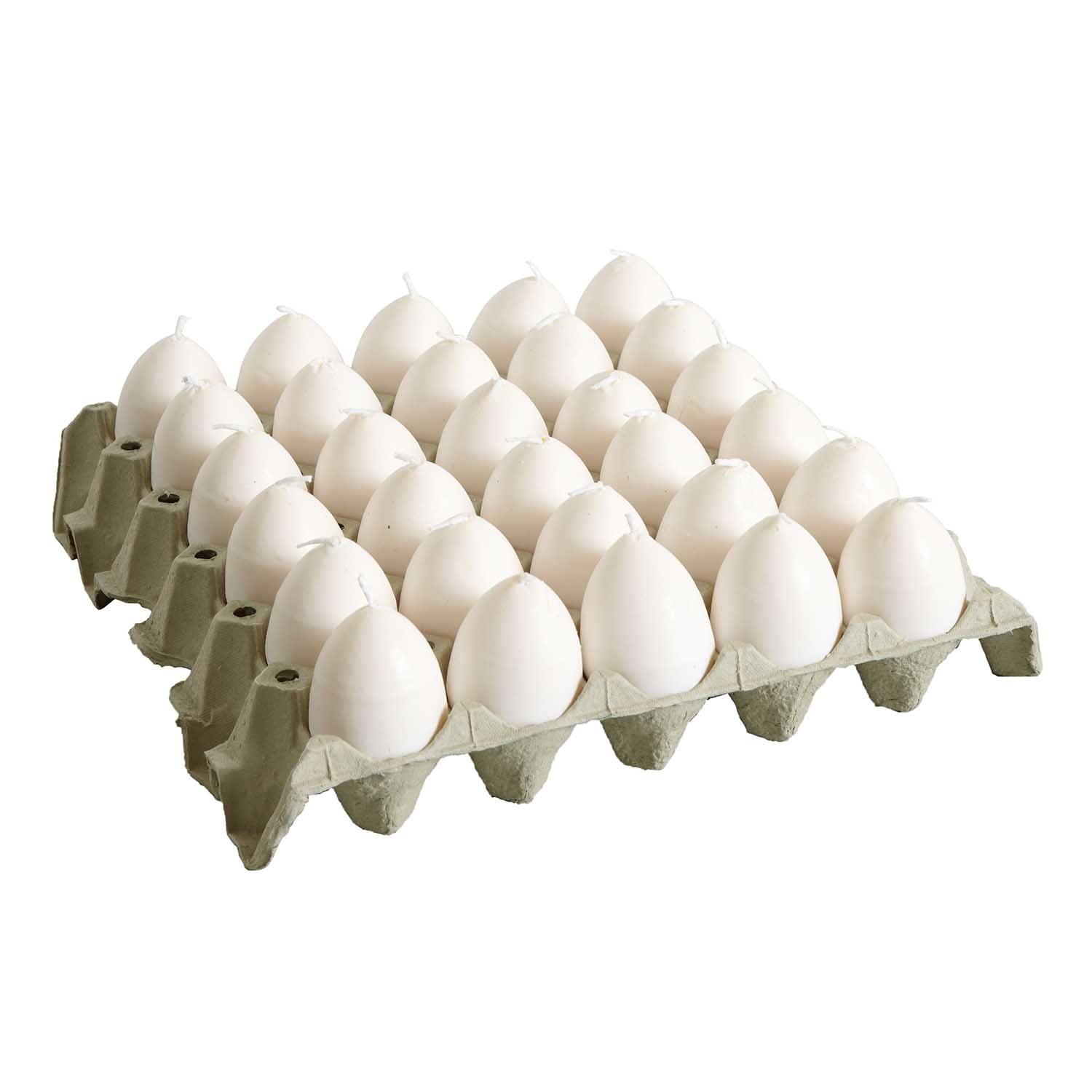 Äggkartong med vita äggformade ljus med gul insida